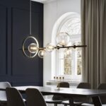 Round flying light bulbs in a luxurious dining room overlooking a huge arched window