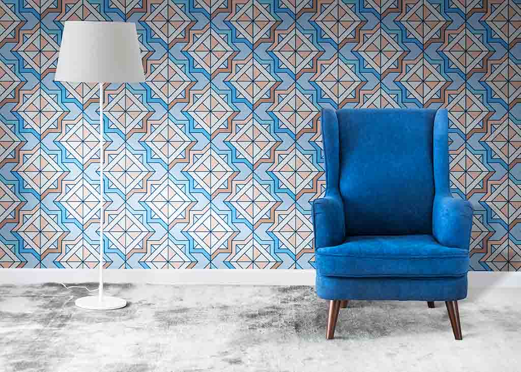 A blue armchair and patterned wallpapers - ZenQ Designs