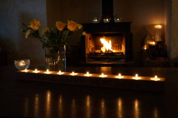 A candlestick with a series of reflective flames - ZenQ Designs