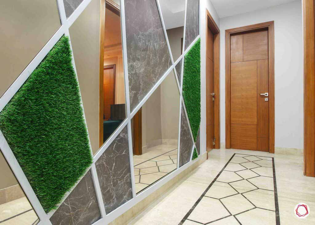 A geometrical play of mirrors, stone and moss on the wall I ZenQ Desighns